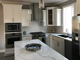 Kitchen With White Counters And Cabinets Small